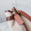 Le créateur de sacs à main vend des sacs de marque féminine chaude à 55% de réduction de coton et de toile en cuir Hanna Letter Sand à glissière Sac