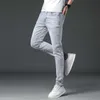 Designer de jeans masculin concepteur d'été mince luminaire de couleur tendance à la mode pour un pantalon masculin élastique élastique slim élastique lavé et blanc européen blanc européen