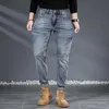 Designer de jeans masculin concepteur de jeans masculin concepteur de jeans pour hommes / été jeans haut de gamme masculin gris slim slim slim small pieds printemps / automne pantalon polyvalent masculin