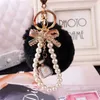 Keychains Lanyards Fashion Faux Fluffy Crystal Bottle Bow Pompom Keychain Pearl Chain nummer 5 Kvinnor Handväska bil Key Chain Ring Keychains smycken