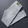 Designer de jeans masculin concepteur d'été mince luminaire de couleur tendance à la mode pour un pantalon masculin élastique élastique slim élastique lavé et blanc européen blanc européen