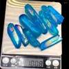 Figurine decorative 100G Crystal Titanio Incristallo Natural Titanio Pilastro Angelo Blue Aura Point Wand Obelisk in vendita