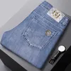 Designer di jeans maschile europeo jeans di fascia alta elastica elastica slim fit piccoli piedi dritti di moda lavati i pantaloni di jeans da uomo