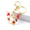 Keychains Lanyards Exquisite Dried Flower A-Z Letter Resin Keychain Creative Glitter 26 Initial Alphabet Keyring Women Handbag Accessories Gifts