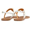 Mångsidig stil escarpin utomhus korsband lyxiga chaussure sommar sandaler kvinnor platt sandaler flip flops strandsko utomhus slingback