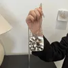 Torby talii lodowe crack crossbody torbe kobiety mini kwadrat 2024 Europejska amerykańska moda łańcucha akrylowa szminka telefonu komórkowego