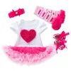 Kinderkleidung, kleines Mädchen, ein Jahr alter kurzärärmischer Wickelrock, Kleinkindschuhe und Socken Set, rosa rosa Kleid