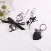 Keychains Vintage Black Frosted Heart Pendant Keychain Fashion Metal Cross Tag Trendy Keyring Bluetooth -hoofdtelefoonhoes Ornament Gift