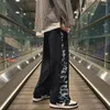 Pantalons masculins hommes Streetwear Streetwear Leopard Patchwork Chic Summer Bouton Summer Handsome Longle Longle de style coréen Teenagers Vertical