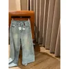 Automne / hiver Luo rouge brodé de la taille arrière étiquette en cuir en cuir denim pantalon à pattes larges