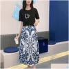 Tweede stuk kleding Merk Women Luxe pak Letter Patroon T -shirt Korte mouwen Korte mouwen mode High Tailed lange rokdruppel leveringskleding otnjd