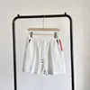 Summer Trendy Markenstil Shorts Trendy einfache gestrickte Hosen für Männer und Frauen High -End -Bein Sport New Chinese Viertelhosen