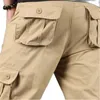 Męskie spodnie Mens Multi-Pieszenne Spodnie Męskie luźne safari z wieloma kieszeniami bawełniany prosty ładunek capris
