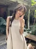 Lässige Kleider Sommerferienkleid Frauen elegant lose einfache ärmellose langer kückenlangen Design Rückenloser Strand Korean Style Vintage