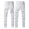 Джинсы Amirir Mens женские дизайнерские джинсы тренд -дыра рваная байкерская джинсовая джинсовая ткань для мужчин с печатью мужские брюки для самостоятельного выращивания.