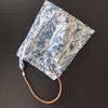 Niche retro new Chinese blue and white porcelain flower bag cowhide shoulder strap underarm bag Oblique straddle bag women thin cloth bag