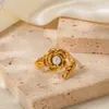 Europäische und amerikanische INS -Stil 18K Gold Edelstahl Kamellienblume Eingelegtes Perlenöffnungsring für vielseitige und nicht verblassende Handschmuck für Frauen