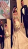 Dubai Arab Luxury Bels Crystal Mermaid Vestidos de noiva de mangas meio compridas Vestidos de noiva do país de pescoço 2018 Vestido de Novi8679016