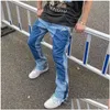 Jeans pour hommes de couleur haute couleurs épissées lavées surdimensionnées larges de jambe droite pantalon flare rétro pantalon décontracté.