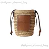 Shoulder Bags Grass woven bag high-quality spring/summer fashionable womens bag Lafite grass trend woven bucket vegetable basket bag handheld T240416