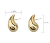 Guldfärg Glossy Water Droplet Comma Stud örhängen för kvinnor Kall och lätt lyxig smyckespresent med högsta kvalitet