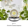 Carriomètre Air Air Solar Solar Rotation Gold Coin Aroma Ornements Perfume de voiture Console Console HEUD LAND LAND LAND LAND LAND LEU Perfume dans la voiture L49