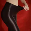 Calzini sexy elastici ad alto elastico leggings sexy sottili olio lucido con collant in gamba alta per la danza da ballo femminile da ballo da ballo.