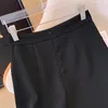 Jupes pour femmes de style chinois jupe noire à bouton fendu enveloppe des fesses à mi-longueur