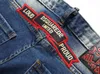 Jeans para hombres Europa y American Fashion Complex Laving Hand Monkey Dot Insignia Decoración colgante Pequeña pierna recta