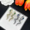 Luksusowe kolczyki stadniski projektanci Miedzika Wąż Dangle Charm 18K Złoty Srebrny Srebrny Kryształowy Rhinestone Uch Ear Stud For Women Fashion Biżuter Wedding Prezent