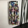 Ensembles de robes à deux pièces à imprimé floral pour femmes de la piste de mode Slash Col Top et longues combinaisons de vitesses