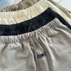 Designer shorts monogrammade sportshorts hiphop casual atletisk lös överdimensionerad dragkropp knähög shorts dimma