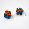 키 체인 12pcs/set 크리에이티브 미니 마법 큐브 3x3cm 키 체인 재미있는 하이퍼 볼 퍼즐 매력 펜던트 키 링 패션 보석 선물