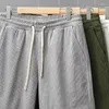 Pantaloni maschili uomini casual pantalini cortometraggi streetwear harem poliestere spiaggia sportiva grande giro elastico estate elastico