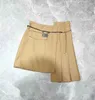 Skirts designer Nanyou Zhi 2024 Early Spring New Fashionable Irregular Pleated Half Skirt Classic Slimming Metal Belt Short ON4U