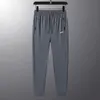 Mens Pants Tech Designer Swearpants Yaz Buz İpek Pantolon Günlük Büyük Boyut Pantolon Bacak Pantolon N Baskılı Çok Boyutlu İsteğe Bağlı