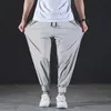 Pantaloni casual di seta di seta di ghiaccio veloce estiva maschile elastico elastico néppolico a raggio solido piedi 7xl 240415