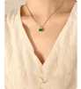 Cold and aloof style niche design non fading titanium steel four claw clasp emerald zircon necklace earrings jewelry set