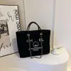 Designer de bolsas de marca 50% desconto em bolsas de ombro novas uma bolsa feminino grande lona de lona crossbody portátil cadeia