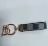 Högkvalitativ läder nyckelchain klassisk nyckelkedjekort korthållare utredning Portachiavi lyxdesigner Keyring söt för kvinnliga män tillbehör