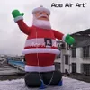 wholesale 10mH (33ft) with blower Newly Style Outdoor Inflatable Christmas Decoration Giant Airblown Santa Claus Balloon Model With Green Glove