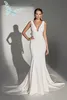 V Neck Elegant Mermaid Wedding Dresses With Bow Stretchy Fit And Flare Sleeveless Boho Garden Bridal Gowns Backless Sexy Sweep Train Buttons Robes de Mariee CL1459