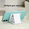 Bärbar telefon Lazy Holder Multi-Angle Justera Universal Foldbar Mobile Phave Desk för iPhone för Samsung Xiaomi