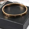 Nieuw merk Classic Designer Bracelet Simple Design Handdecoratie Diamant ingelegde zirkon titanium stalen armband Rose Gold binnenste gladde roestvrije vrouw