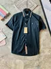 رجال الموضة زهرة النمر طباعة القمصان الزر غير الرسمي أسفل الأكمام قصيرة قميص هاواي بدلات صيف الشاطئ مصمم القمصان A36