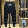 Jeans hommes couleurs solides cordon de crampon élastique pantalon de cargaison lâche printemps automne de style coréen de style coréen lié pantalon harem streetwear 240415