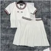 Двухклассные вязаные женские джемперы топ -юбки Set Set Luxury Designer Letters Contrast Color Tees плиссированные юбки элегантная повседневная otfdn