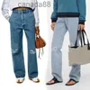 Designer jeans kvinnor ankomster hög midja gata ihålig lapp broderad dekoration avslappnad blå rak denim byxor ldvl