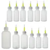 Bouteilles de rangement 10 pcs bouteille d'art 30 ml 50 ml 100 ml de pointe à aiguille à collecte de flux liquide dispensateur applicateur de distribution de distribution en plastique