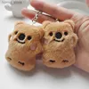 Keychains en peluche 1pcs grincement petit ours brun en peluche jouet mini-ours poupée jouet sac de trèflé